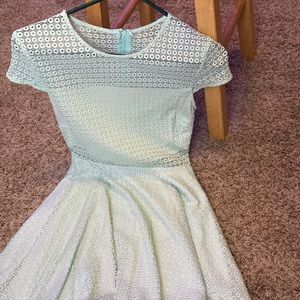 Teal, see through mesh like top with a built in white cover piece so cute